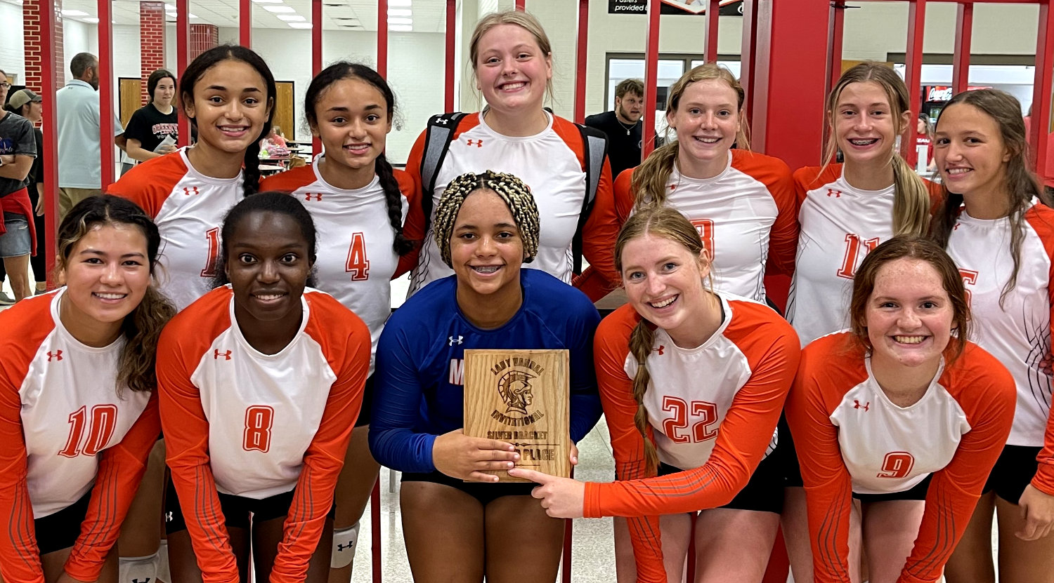 The Mineola Lady Jackets show off their silver bracket trophy from the Van tournament last weekend.